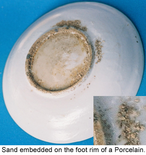 Embedded materials on the foot rim of an ancient Chinese Porcelain